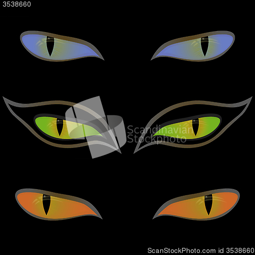 Image of Three pairs of cat eyes over black