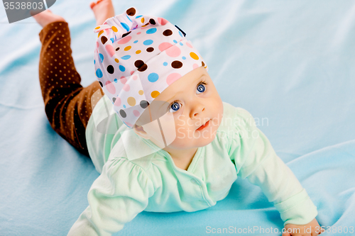 Image of baby girl in a hat. Studio