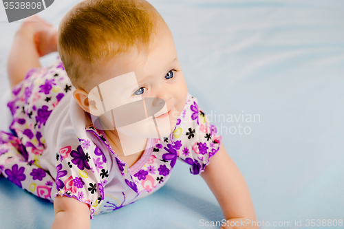 Image of baby girl in a dress. Studio