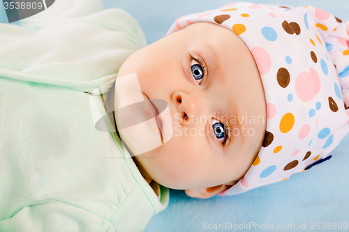 Image of baby girl in a hat. Studio