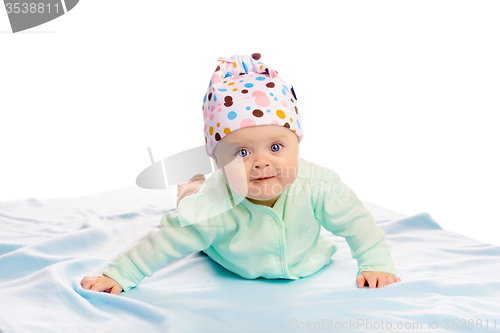 Image of baby girl in a hat. Studio