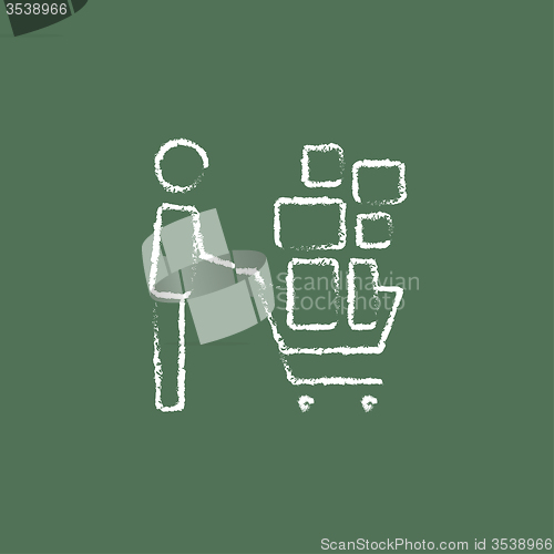 Image of Man pushing shopping cart icon drawn in chalk.