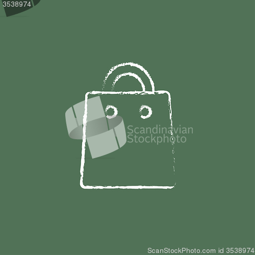 Image of Shopping bag icon drawn in chalk.