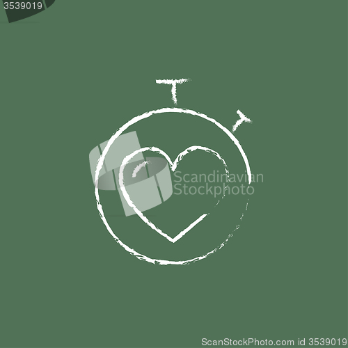 Image of Stopwatch with heart icon drawn in chalk.