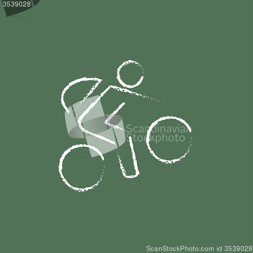 Image of Bike and cyclist icon drawn in chalk.
