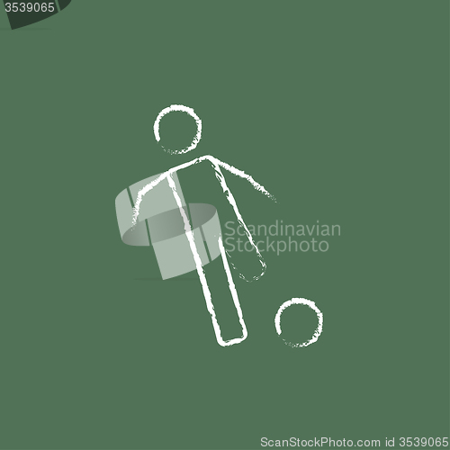 Image of Soccer player with ball icon drawn in chalk.