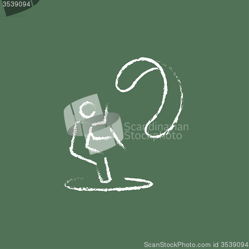 Image of Kite surfing icon drawn in chalk.