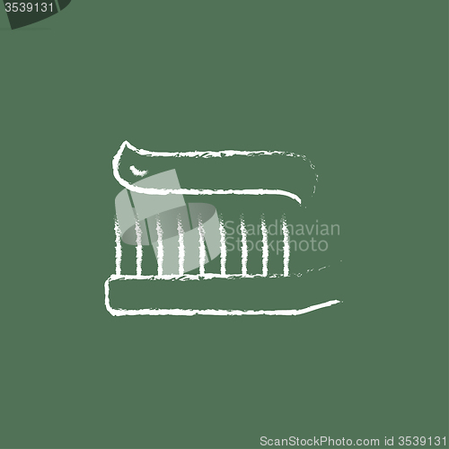 Image of Toothbrush with toothpaste icon drawn in chalk.