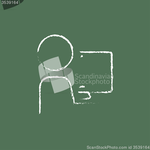 Image of Man working at his computer icon drawn in chalk.