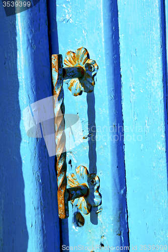 Image of blue metal    morocco in  facade home and safe padlock 