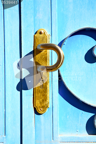 Image of blue metal rusty  brown    morocco in   safe padlock 