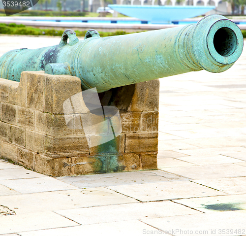 Image of bronze cannon in africa morocco  green  and the old pavement