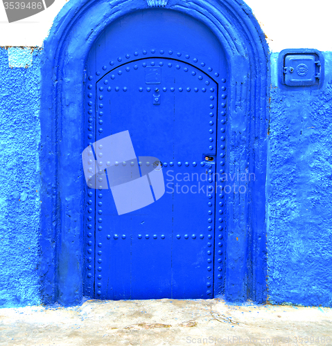 Image of historical blue  in  antique building door morocco      style af