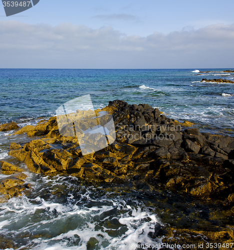 Image of water  in lanzarote  isle foam rock   stone sky cloud beach  