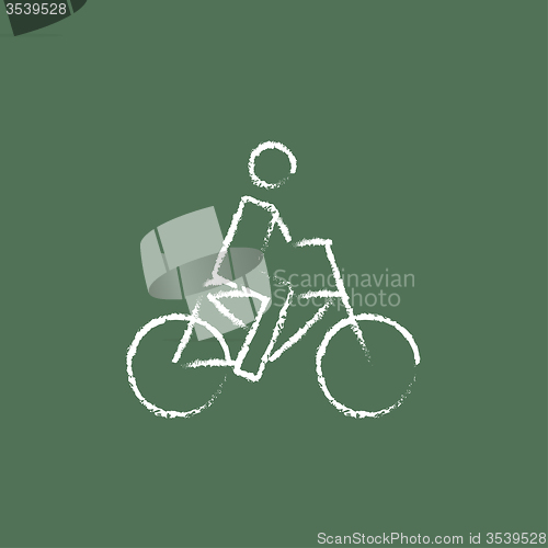 Image of Bike and cyclist icon drawn in chalk.