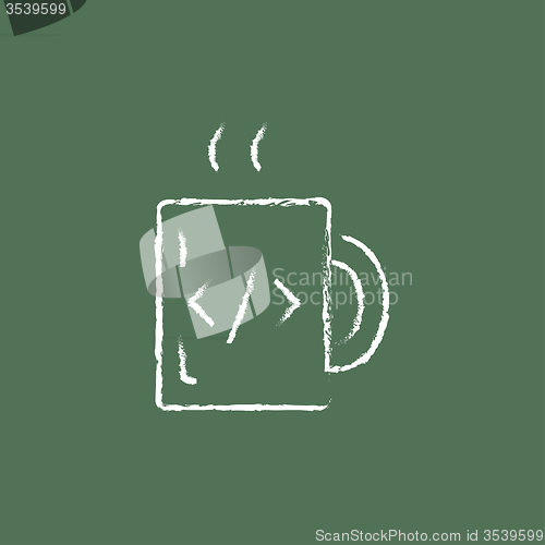 Image of Cup of coffee with a code sign icon drawn in chalk.