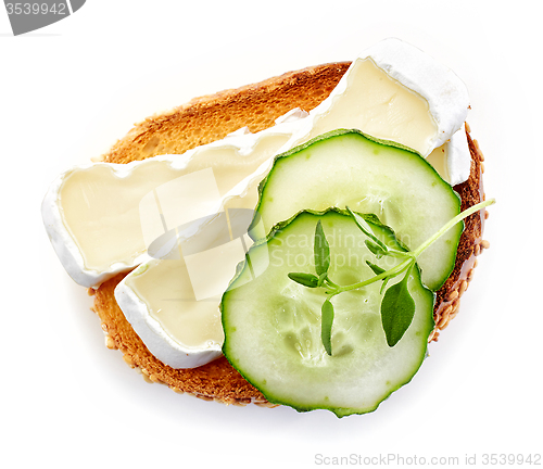 Image of toasted bread with brie and cucumber