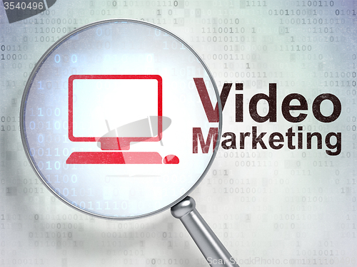 Image of Finance concept: Computer Pc and Video Marketing with optical glass
