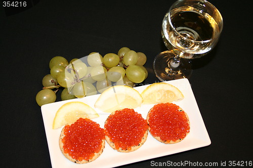 Image of Russian caviar and a glass of white wine