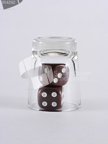 Image of Brown Dice Under Glass