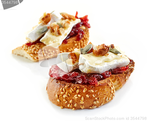 Image of toasted bread with jam and brie