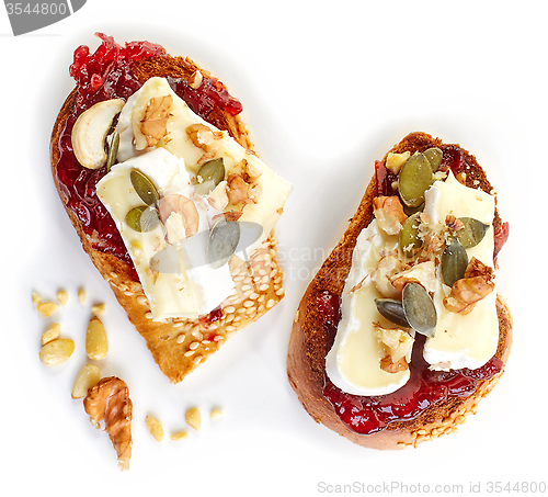 Image of toasted bread with jam and brie