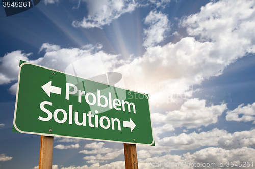 Image of Problem and Solution Green Road Sign Over Clouds