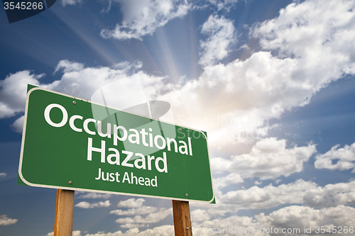 Image of Occupational Hazard Green Road Sign Over Clouds