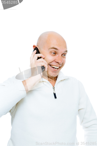 Image of Bald man emotionally communicates by phone. Isolated. Studio