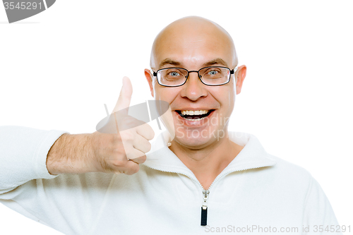 Image of Bald man smiling with thumb up. Isolated on white. Studio