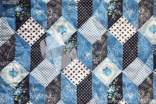 Image of old fabric in blue, black and white
