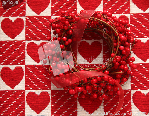 Image of wreath with red berries and hearts