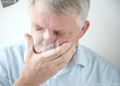 Image of older man feels nausea