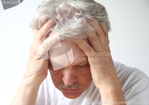 Image of deeply depressed older man  