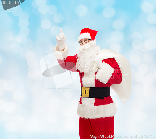 Image of man in costume of santa claus with bag
