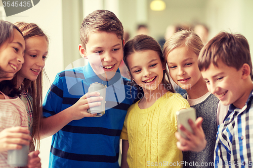 Image of group of school kids with smartphone and soda cans