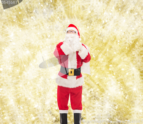 Image of man in costume of santa claus with bag