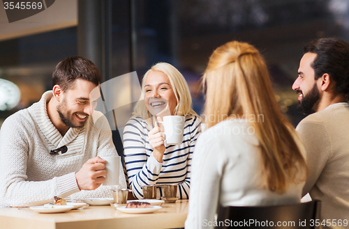 Image of happy couple meeting and drinking tea or coffee