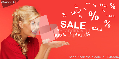 Image of woman with sale and percentage signs over red