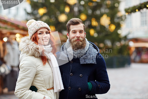 Image of happy couple walking in old town