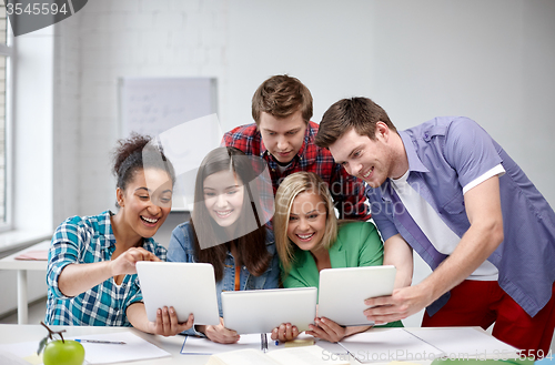 Image of group of happy high school students with tablet pc