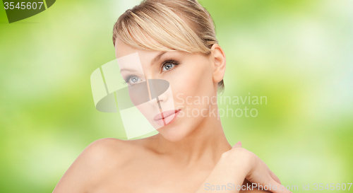 Image of beautiful young woman with bare shoulders