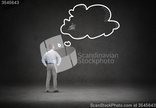 Image of businessman looking at empty text bubble