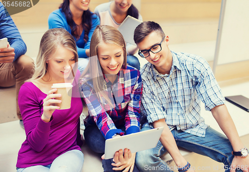 Image of group of students with tablet pc and coffee cup