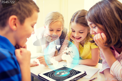 Image of group of school kids with tablet pc in classroom