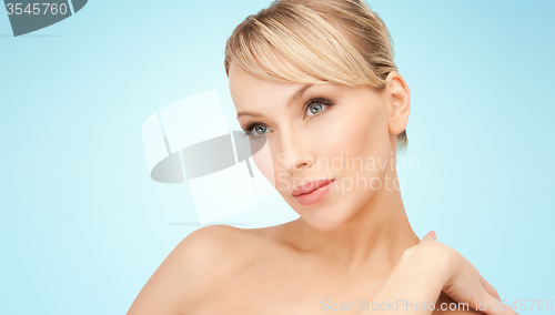 Image of beautiful young woman with bare shoulders