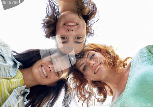 Image of happy young women or teenage girls in circle