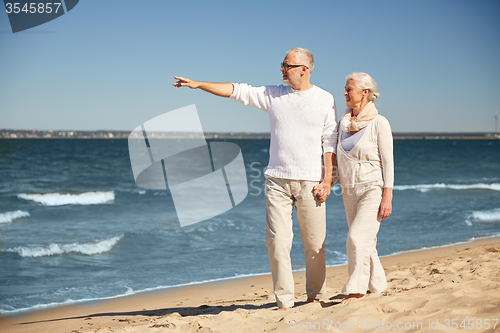 Image of happy senior couple on summer beach