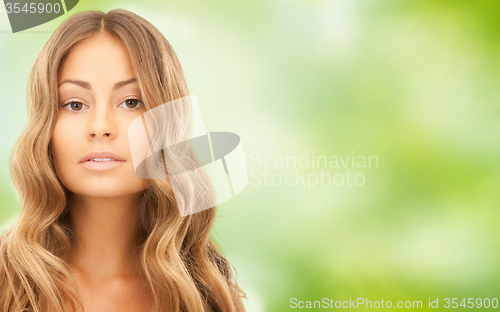 Image of beautiful young woman face with long hair