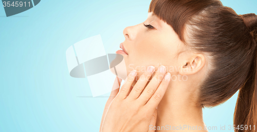 Image of beautiful young woman face side view